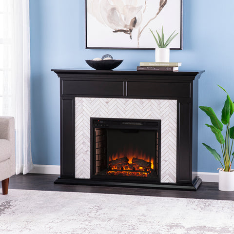 Image of Fireplace mantel w/ authentic marble surround in eye-catching herringbone layout Image 1