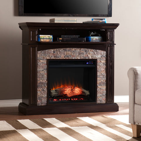 Image of Corner convertible fireplace w/ faux stone surround Image 1