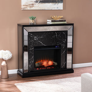 Elegant mirrored fireplace mantel w/ faux stone surround Image 1