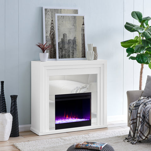 Image of Mixed material fireplace mantel w/ mirrored surround Image 3