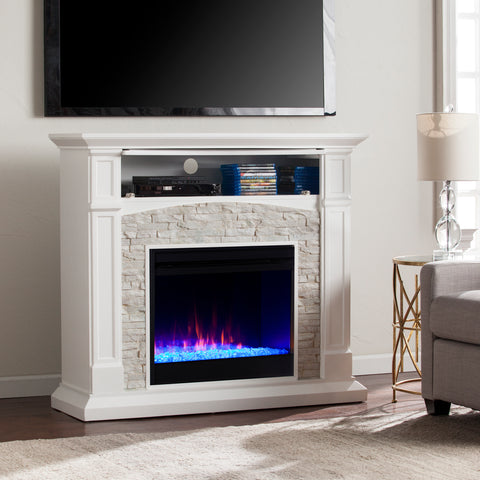 Image of Color changing fireplace w/ stacked faux stone surround Image 2