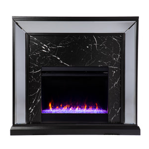 Elegant mirrored fireplace mantel w/ faux stone surround Image 2