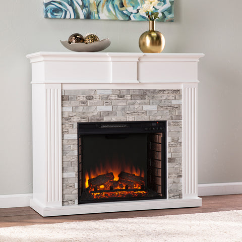 Image of Classic electric fireplace w/ modern faux stone surround Image 1