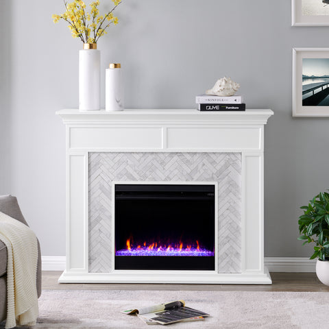 Image of Fireplace mantel w/ authentic marble surround in eye-catching herringbone layout Image 1