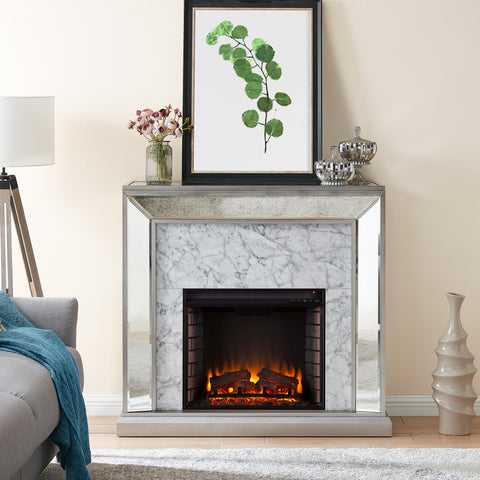 Image of Elegant mirrored fireplace mantel w/ faux stone surround Image 1