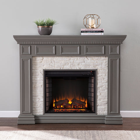 Image of Classic electric fireplace w/ stacked faux stone surround Image 1