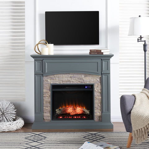 Image of Electric fireplace w/ faux stone surround Image 1