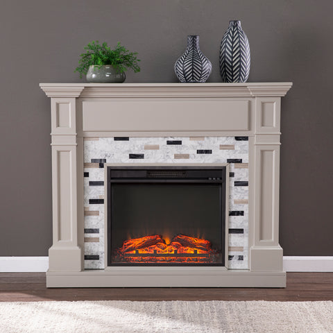 Image of Classic electric fireplace with multicolor marble surround Image 1