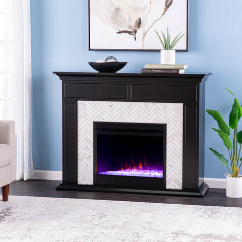 Image of Fireplace mantel w/ authentic marble surround in eye-catching herringbone layout Image 1